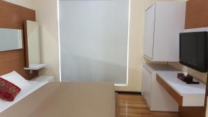 Telewizja i/lub zestaw kina domowego w obiekcie Daily Home