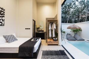 Postel nebo postele na pokoji v ubytování Villa Yu Pool Villa + 21 fotografií