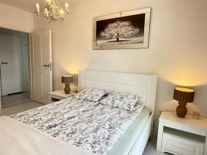 Posteľ alebo postele v izbe v ubytovaní Ann Apartament Gdańsk