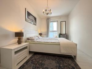Posteľ alebo postele v izbe v ubytovaní Ann Apartament Gdańsk