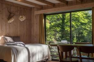 Postel nebo postele na pokoji v ubytování Hotel y Termas Huife