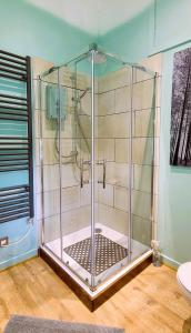 a shower with a glass enclosure in a bathroom at Luxury Speyside Hideaway, Dog Friendly, Malt Whisky Trail, Village Green in Archiestown +33 photos