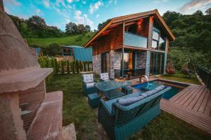 a house with a swimming pool in the yard at Yazici Green Villas Tatil Koyu in Rize