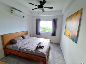 Postel nebo postele na pokoji v ubytování Tablas Seaview Homestay