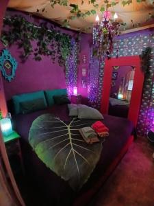 A bed or beds in a room at MAISONETTE Fata Bislacca, calcata