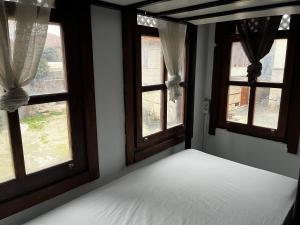 Postel nebo postele na pokoji v ubytování Kuyu Beergarden Hostel