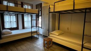 Postel nebo postele na pokoji v ubytování Kuyu Beergarden Hostel