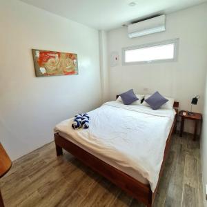 Postel nebo postele na pokoji v ubytování Tablas Seaview Homestay