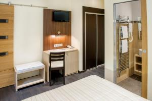 Postel nebo postele na pokoji v ubytování Hôtel La Source