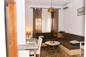 a living room with a couch and a table at Excellency apartmani in Banja Luka