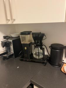a kitchen counter with a mixer and a coffee maker at Hybel leilighet nær sentrum in Stavanger