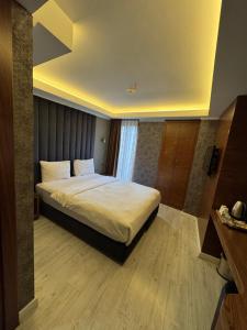 Postel nebo postele na pokoji v ubytování Sultan city hotel