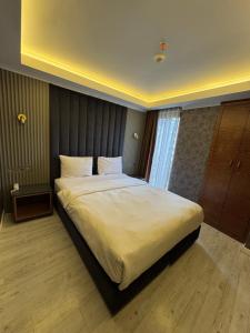Postel nebo postele na pokoji v ubytování Sultan city hotel