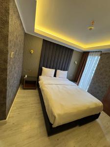 Postel nebo postele na pokoji v ubytování Sultan city hotel