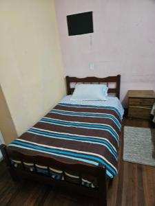 Postel nebo postele na pokoji v ubytování Habitación con cama matrimonial mas cama 1 plaza