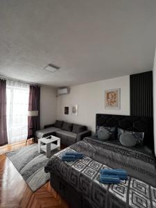 Postel nebo postele na pokoji v ubytování Apartman RISTIC