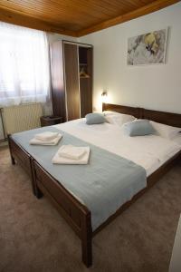 A bed or beds in a room at MB Hotel