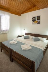 A bed or beds in a room at MB Hotel