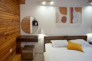 A bed or beds in a room at MB Hotel