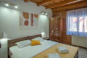 A bed or beds in a room at MB Hotel
