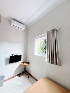 Ένα ή περισσότερα κρεβάτια σε δωμάτιο στο Guest House Kraton Mas