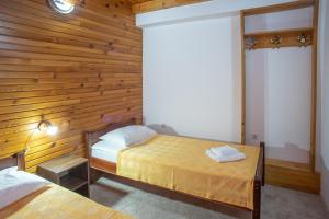 A bed or beds in a room at MB Hotel