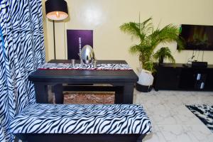 a mirror sitting on a piano in a room at Nights over Kenya in Bamburi