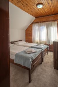 A bed or beds in a room at MB Hotel