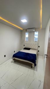 Ένα ή περισσότερα κρεβάτια σε δωμάτιο στο Apartamento 3 quartos no centro