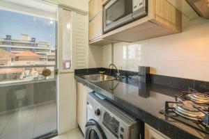 Η κουζίνα ή μικρή κουζίνα στο Apartamento Palazzo Em bominhas