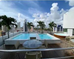 a swimming pool on the roof of a building at Gold flat Manaíra 602 in João Pessoa