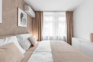 Postel nebo postele na pokoji v ubytování Residence Mrázova