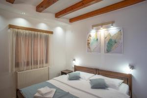 A bed or beds in a room at MB Hotel