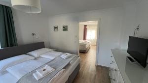 Postel nebo postele na pokoji v ubytování Gästewohnung Schlossblick