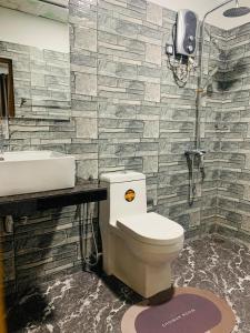 a bathroom with a toilet and a sink at Nethuli Inn Ella in Ella +23 photos