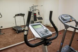 a gym with a cell phone on a treadmill at BH Kristály in Debrecen