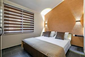Posteľ alebo postele v izbe v ubytovaní D&A Apartments