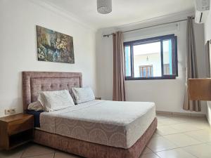 Voodi või voodid majutusasutuse Appartement Al Amal toas