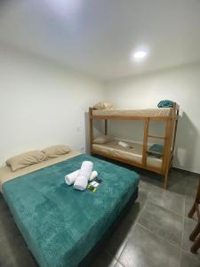 a bed with a stuffed animal sitting on top of it at Rincón del parana in Puerto Iguazú +23 photos