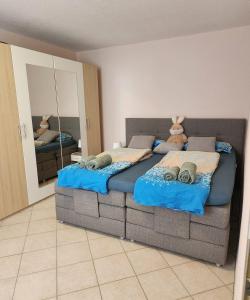 a bedroom with two beds with teddy bears on them at SJ Apartment in Chemnitz