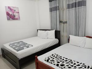 Letto o letti in una camera di Mystik Muthu View Resort