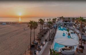 a view of a resort with a pool and a beach at Amplio Estudio en Valencia in Valencia