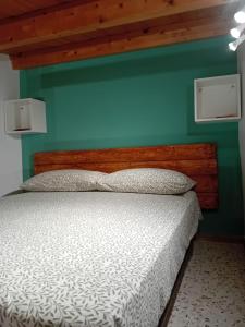 Postel nebo postele na pokoji v ubytování Ai Sette Scalini