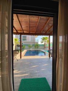 a view of a swimming pool from a house at Detached and luxury villa in kadriye in Belek