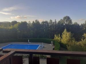 a view of a swimming pool from a balcony at Splendido Chalet in Camigliatello Silano