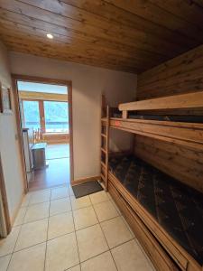 a room with two bunk beds and a doorway at BEC 562 - Beautiful apt 4pers - Tignes le Lac in Tignes