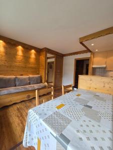 a living room with a bed and a couch at BEC 562 - Beautiful apt 4pers - Tignes le Lac in Tignes