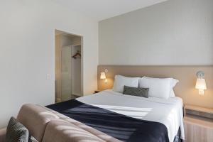 Cama ou camas em um quarto em Staybridge Suites São Paulo by IHG