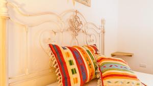 A bed or beds in a room at Smart Appart Villa Patrizia