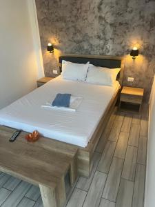 En eller flere senge i et værelse på Vila Iris